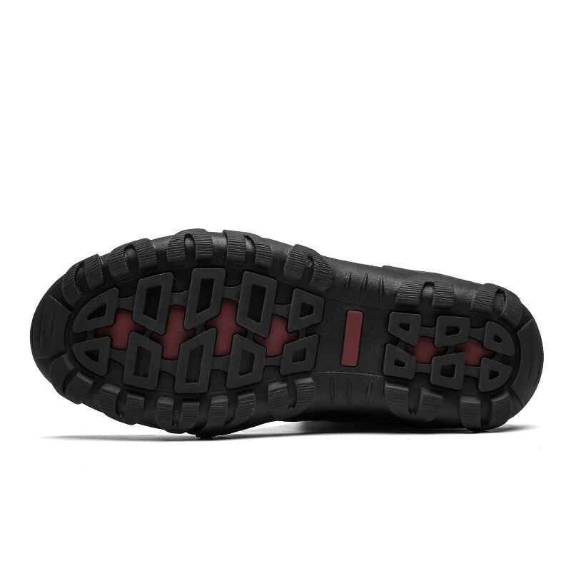 Non-slip rubber outsole of lace-up waterproof snow boots, showcasing sturdy grip and traction for winter conditions.